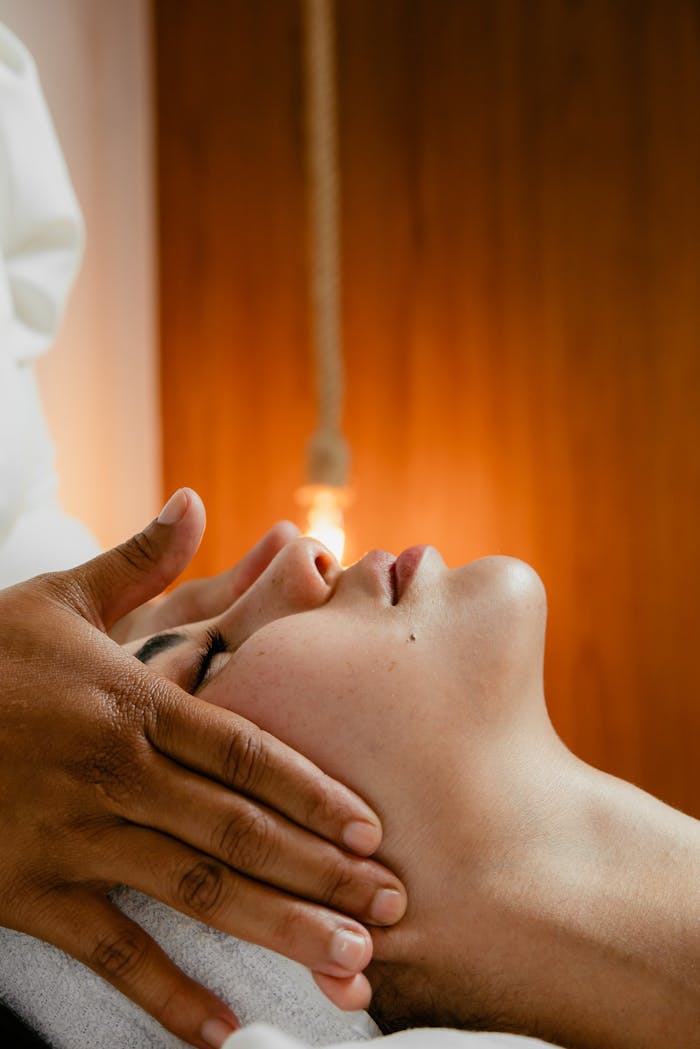 about-04 A peaceful facial massage in a warm spa environment, promoting relaxation and wellness.